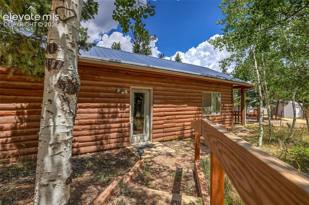 Image 4 of 28: Expansive outdoor deck featuring maintenance free composite decking, a log