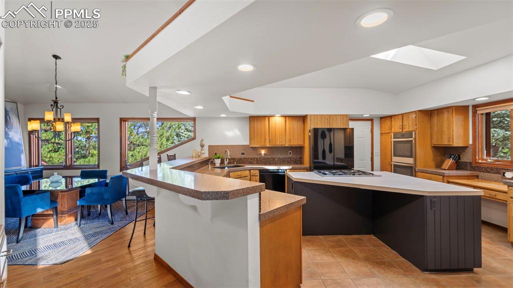 Image 11 of 46: This updated open-concept home showcases expansive windows that flows seaml