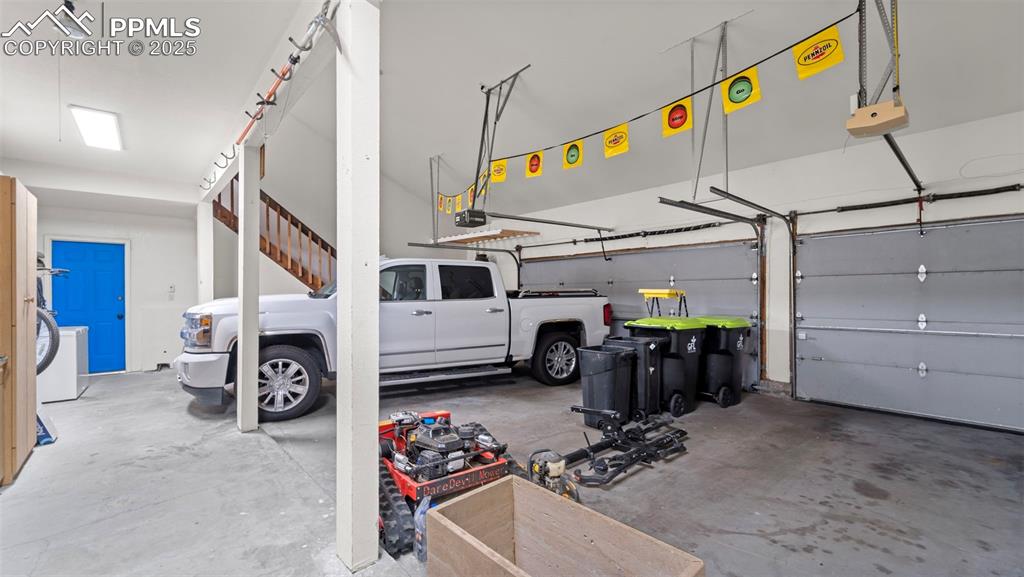 Image 36 of 46: 3 car heated garage with bonus loft, garage of your dreams!