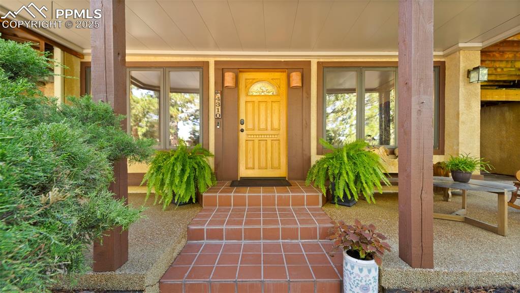 Image 5 of 46: Doorway to property with a porch