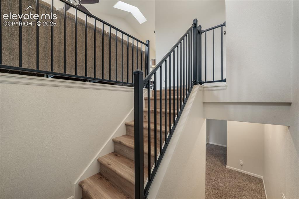 Image 24 of 50: Staircase From Upper Level to Lower Level