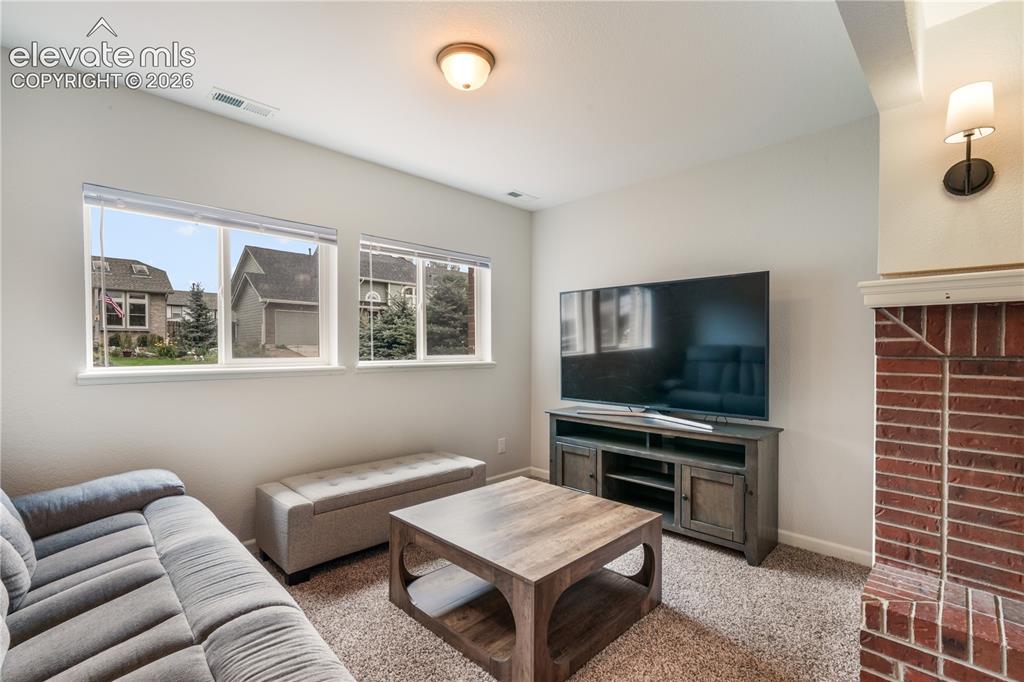 Image 26 of 50: Lower Level Living Room with Great Natural Light