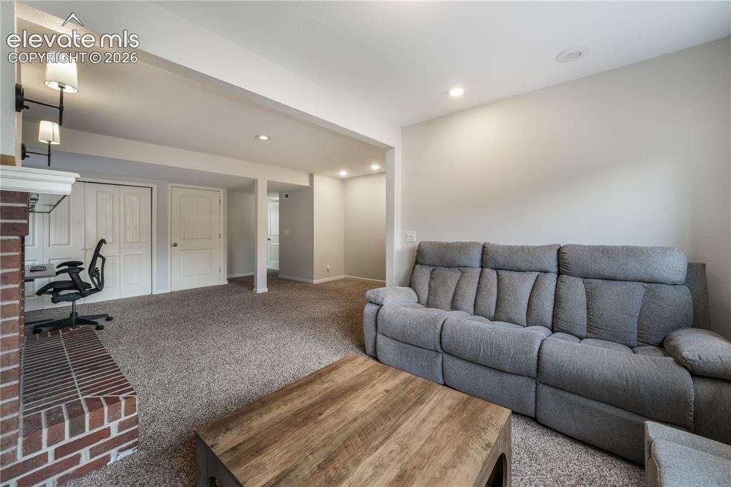 Image 29 of 50: Lower Level Living Room with Tons of Room for Entertaining