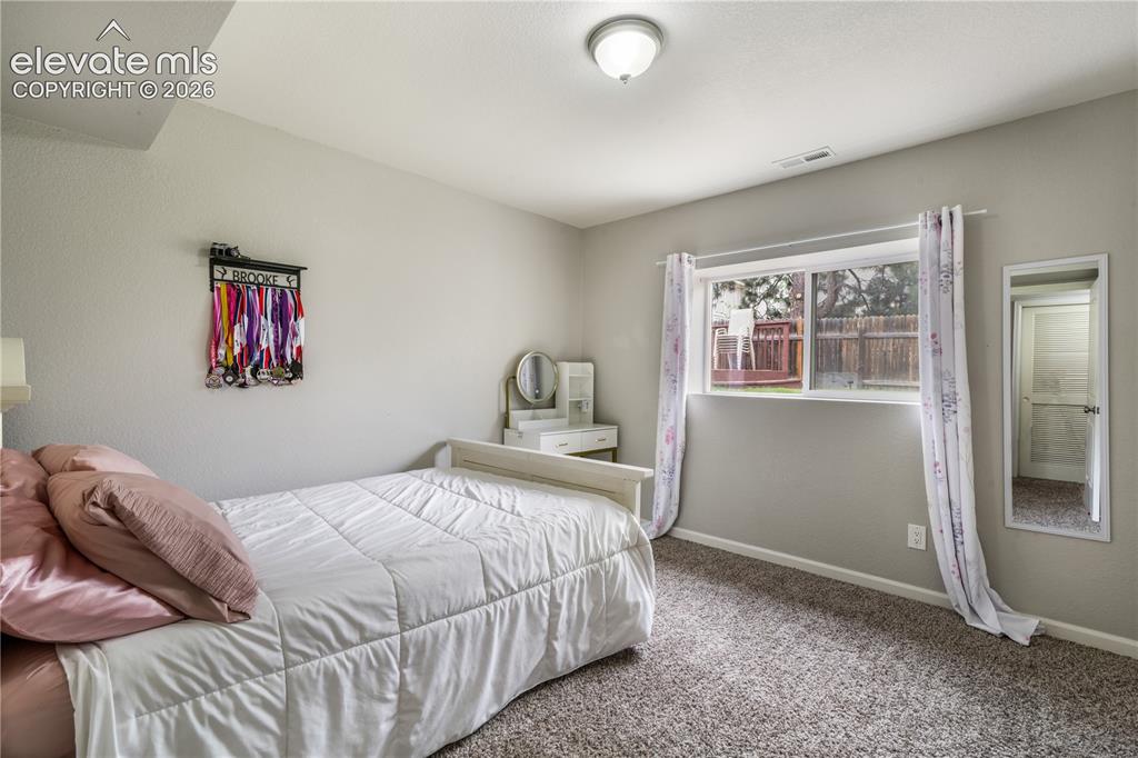 Image 33 of 50: Lower Level Bedroom with Natural Light