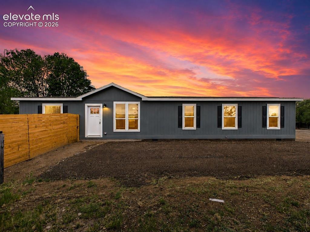 Caption: Front Exterior (Twilight) – Striking twilight exterior highlights the home