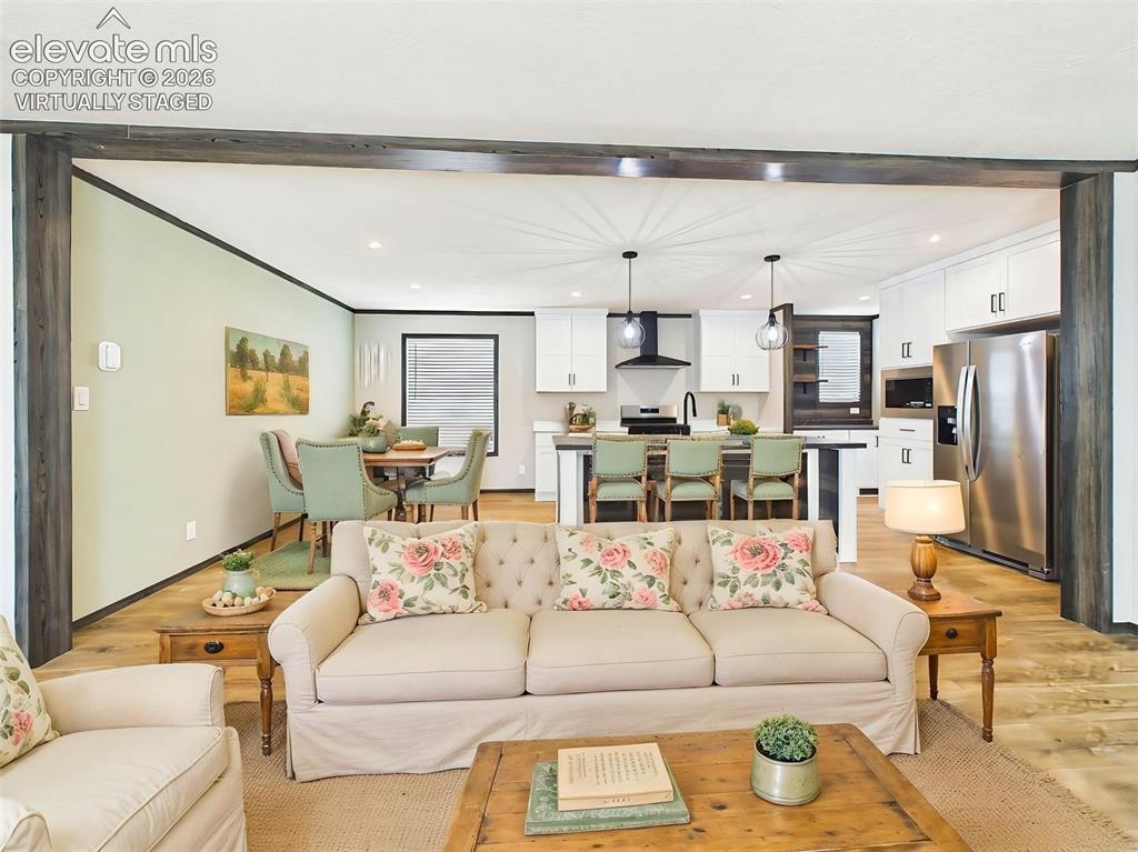 Image 10 of 50: (Virtually Staged) Open-Concept Living – Wide-angle view highlighting the s