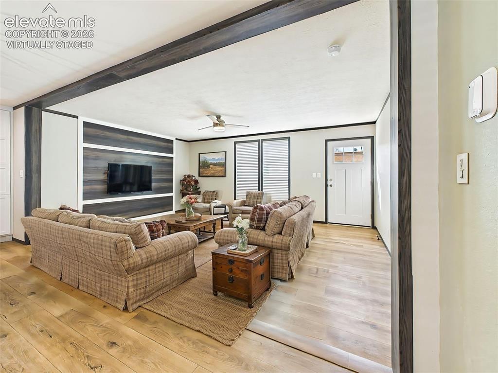 Image 12 of 50: (Virtually Staged) Living Room – Spacious living room featuring a striking 