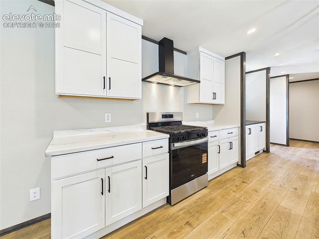 Image 16 of 50: Kitchen – Modern kitchen featuring shaker-style cabinetry, beautiful counte