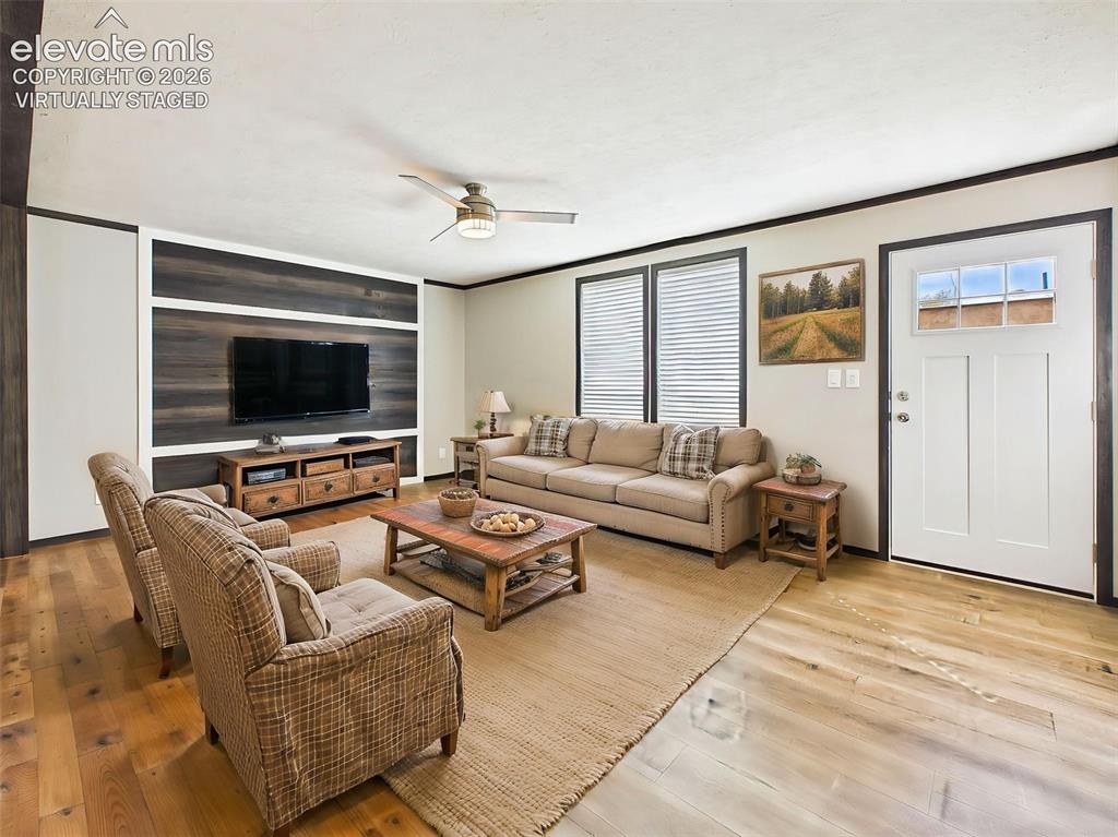 Image 2 of 50: (Virtually Staged) Living Room – Comfortable gathering space featuring a cu
