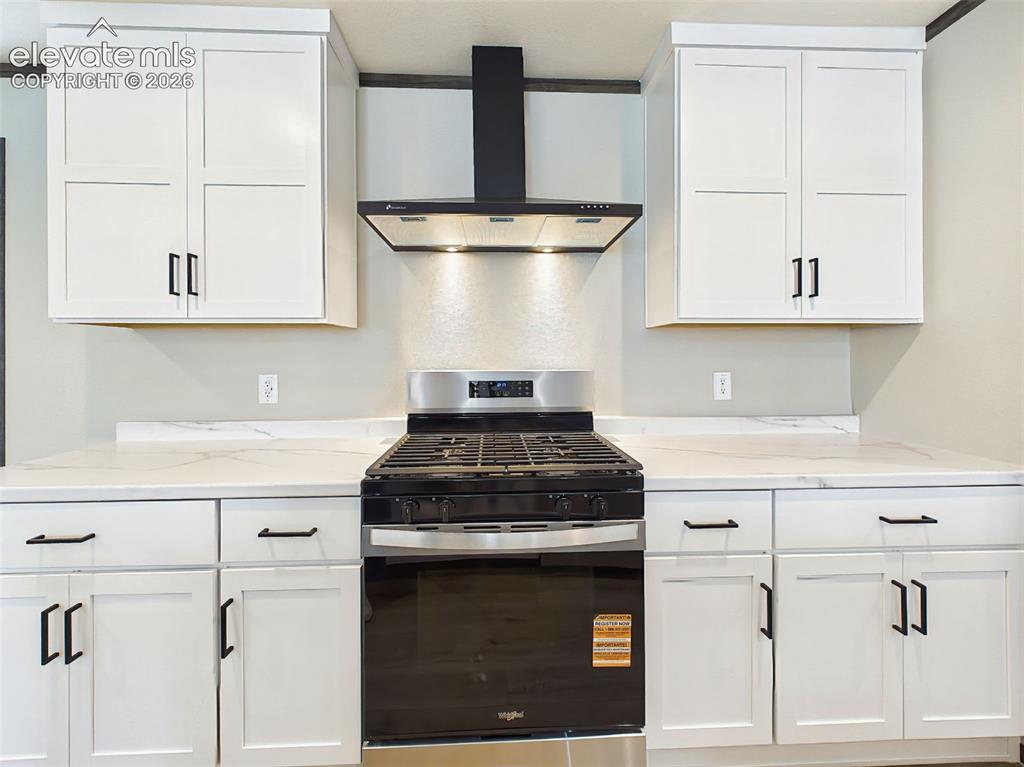 Image 24 of 50: Kitchen – Beautifully appointed kitchen featuring shaker-style cabinetry, d