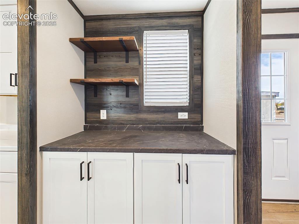 Image 25 of 50: Coffee Bar – Dedicated beverage station with additional cabinetry, countert