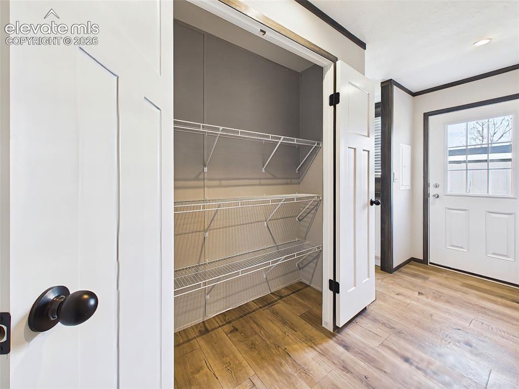 Image 26 of 50: Pantry – Large pantry with multiple wire shelving levels, providing abundan