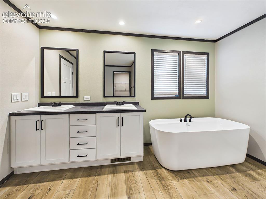Image 30 of 50: Primary Bathroom – Bright and inviting primary bath showcasing dual vanitie