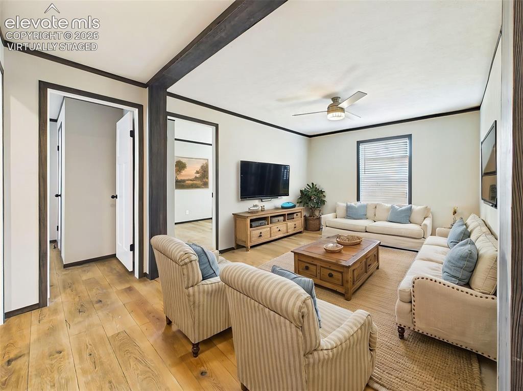 Image 34 of 50: (Virtually Staged) Family Room – Bright, open-concept family room offering 