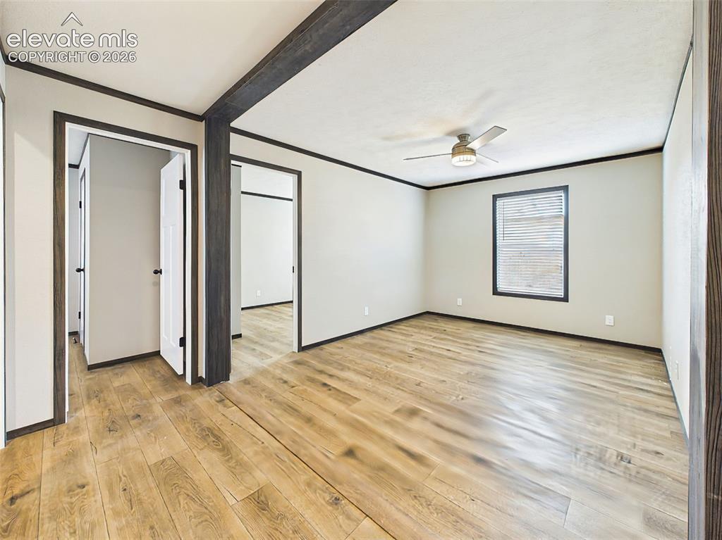 Image 35 of 50: Family Room – Spacious living area with durable wood-style flooring, ceilin