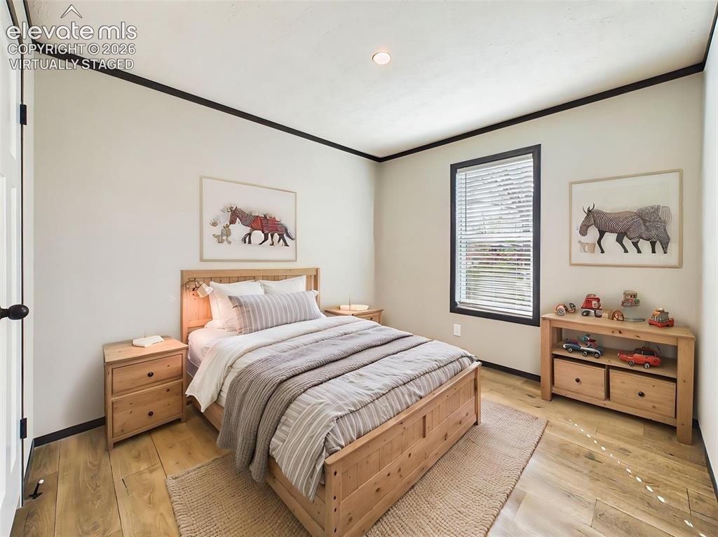 Image 38 of 50: (Virtually Staged) Bedroom 2 – Comfortable secondary bedroom showcasing a v