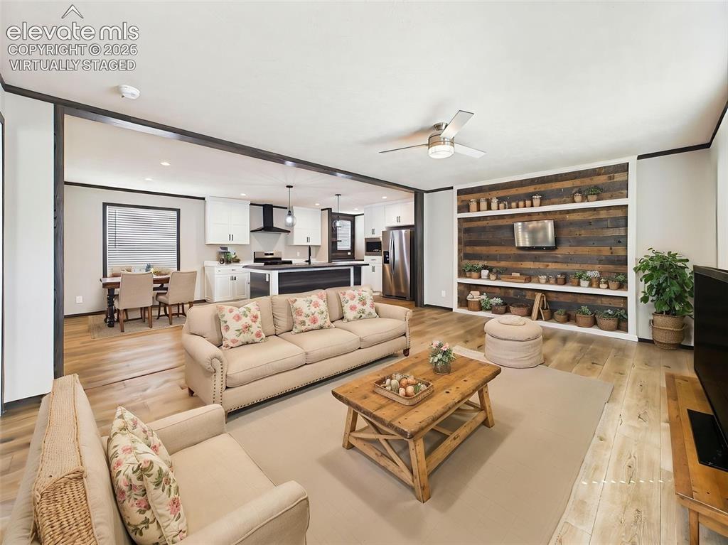 Image 4 of 50: (Virtually Staged) Great Room – Spacious open-concept great room showcasing