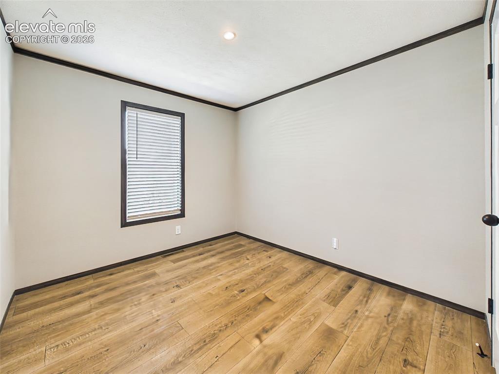 Image 41 of 50: Bedroom 3 – Well-proportioned secondary bedroom featuring neutral finishes 