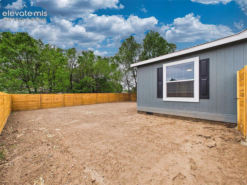 Image 47 of 50: Backyard – Spacious, fully fenced backyard offers plenty of room to create 