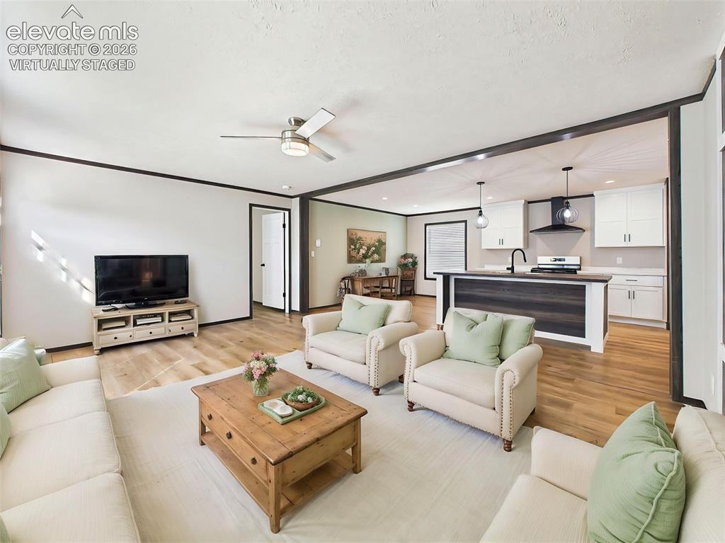 Image 6 of 50: (Virtually Staged) Great Room – Alternate view highlighting the generous li