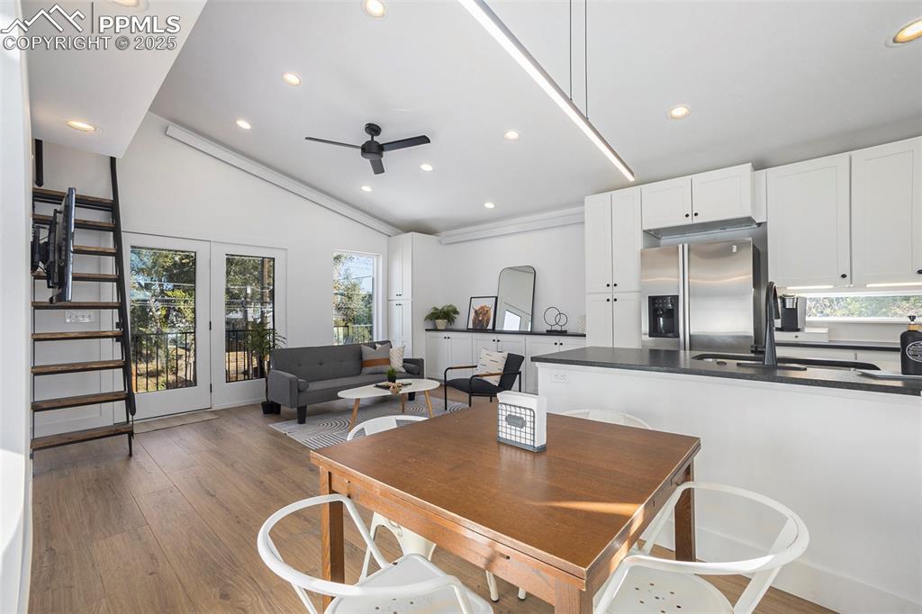 Image 19 of 38: Dining room with light wood-style flooring, recessed lighting, ceiling fan,