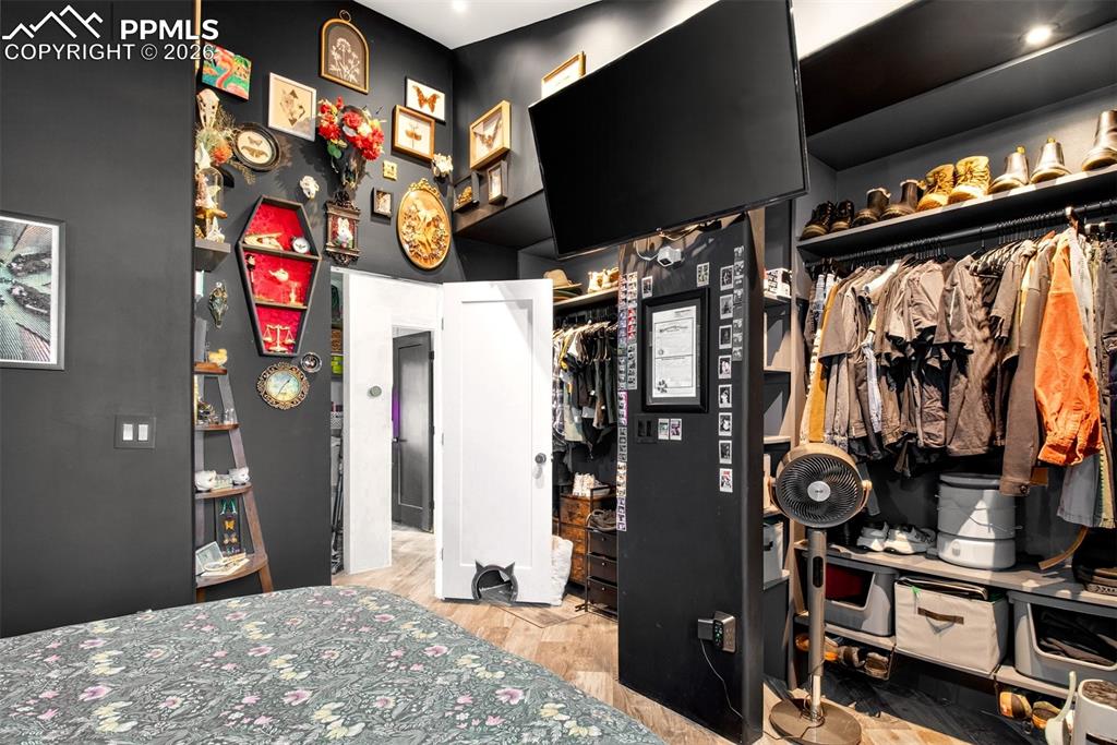 Image 11 of 17: Spacious primary bedroom featuring abundant closet space. 