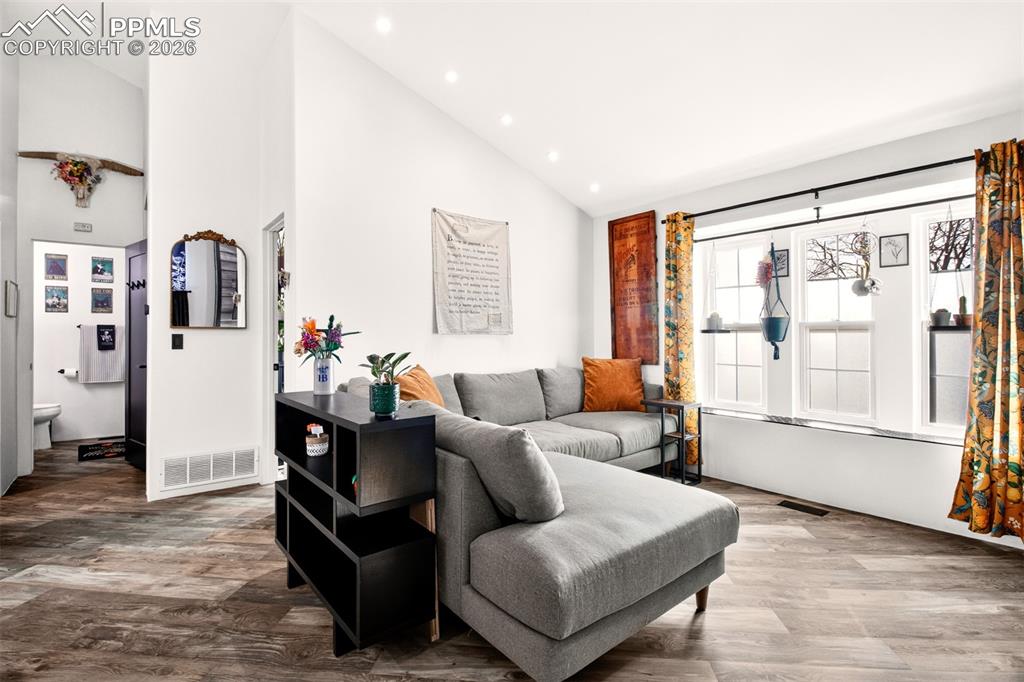 Image 4 of 17: The living room offers cozy window seating, perfect for relaxing and enjoyi