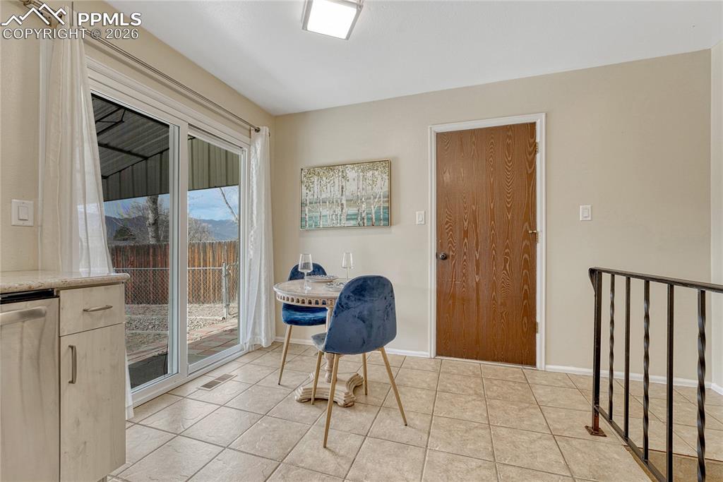 Image 14 of 49: Dining area with walk out to backyard
