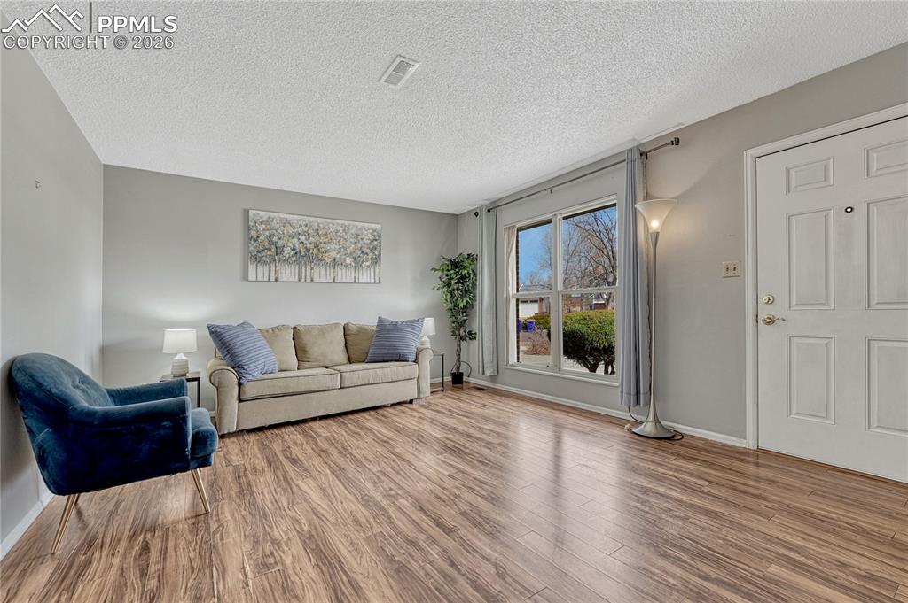 Image 4 of 49: Large picture window gives natural light