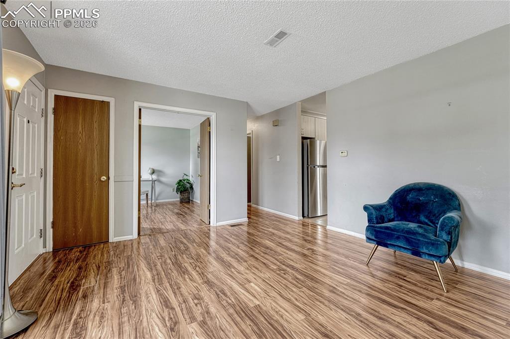 Image 5 of 49: Looking into the office with double doors from the living room