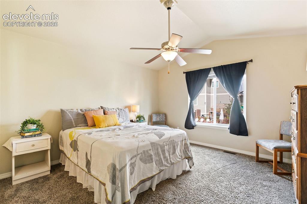 Image 14 of 27: Primary bedroom with en-suite bathroom and walk-in closet