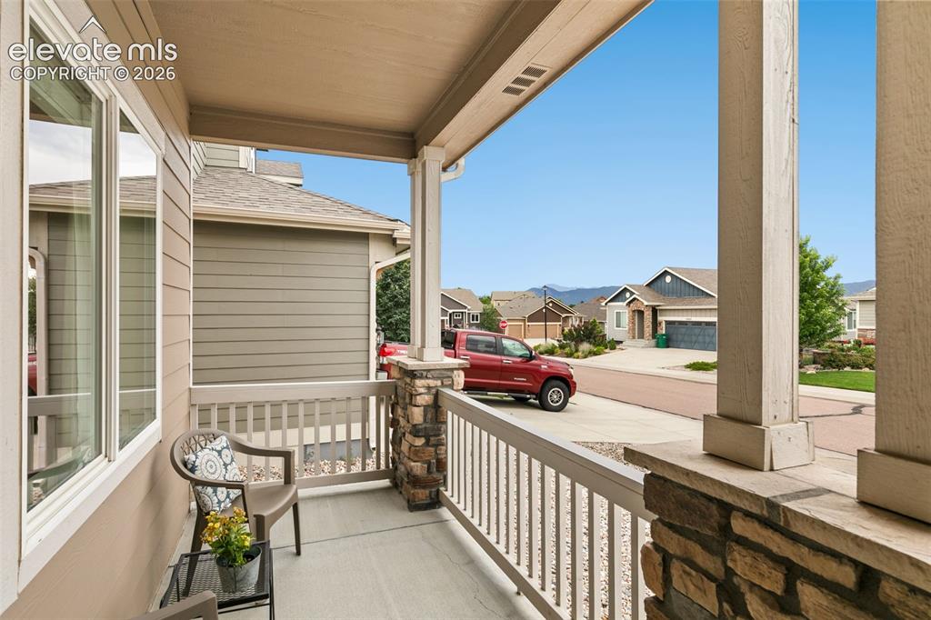 Image 3 of 27: Front porch with mountain views