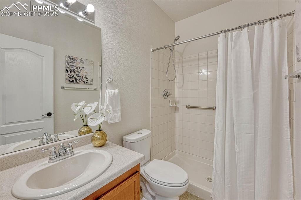 Image 9 of 27: Full bath with walk in shower