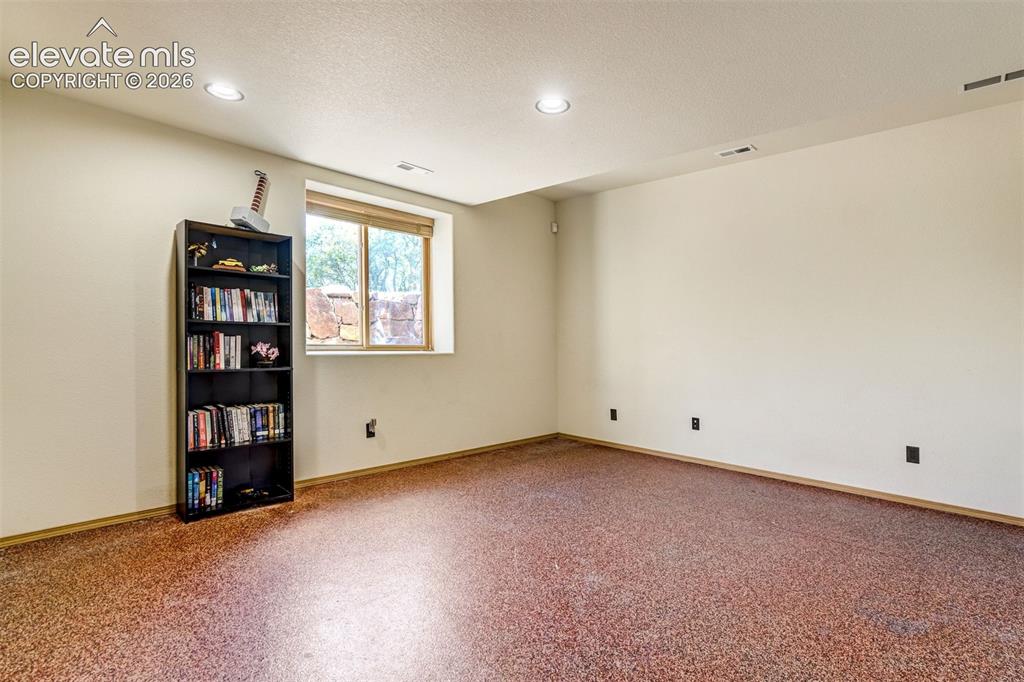 Image 43 of 50: One of two bedrooms in the basement.
