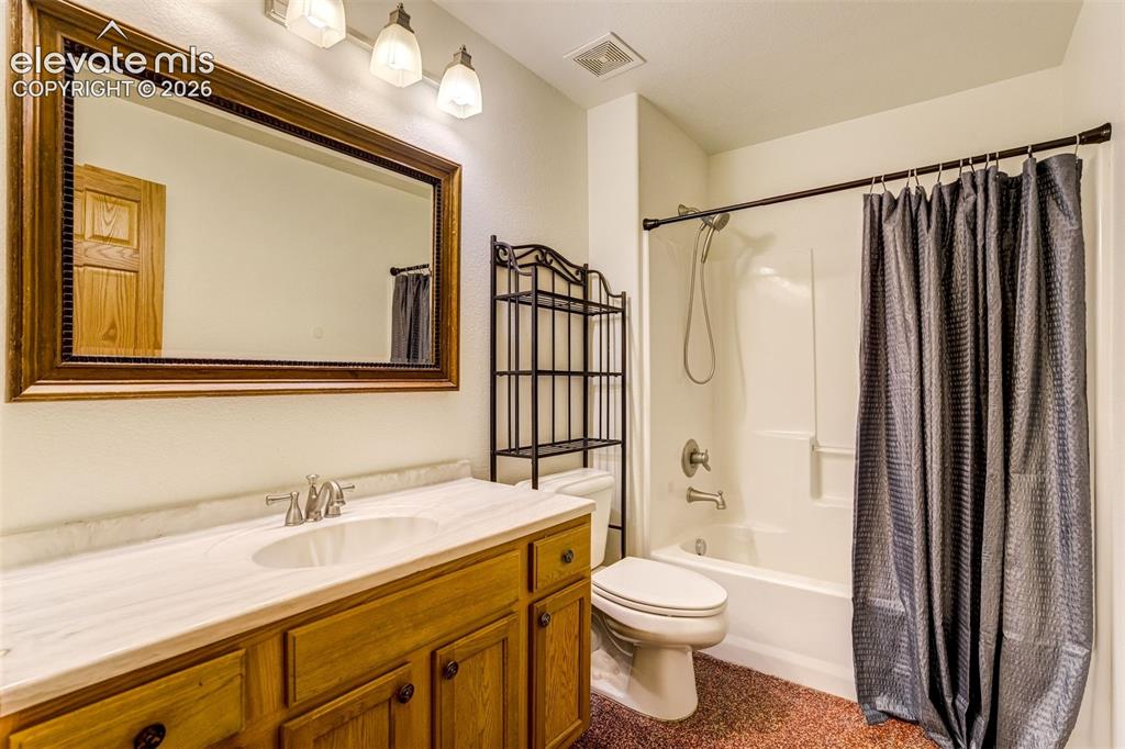 Image 44 of 50: Full bathroom in the basement.