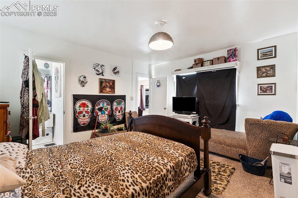 Image 37 of 49: Bedroom with carpet