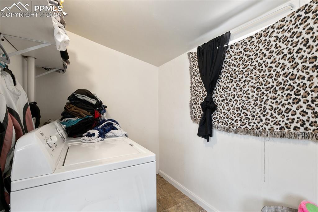 Image 43 of 49: Laundry area featuring laundry area, washer and dryer, and baseboards