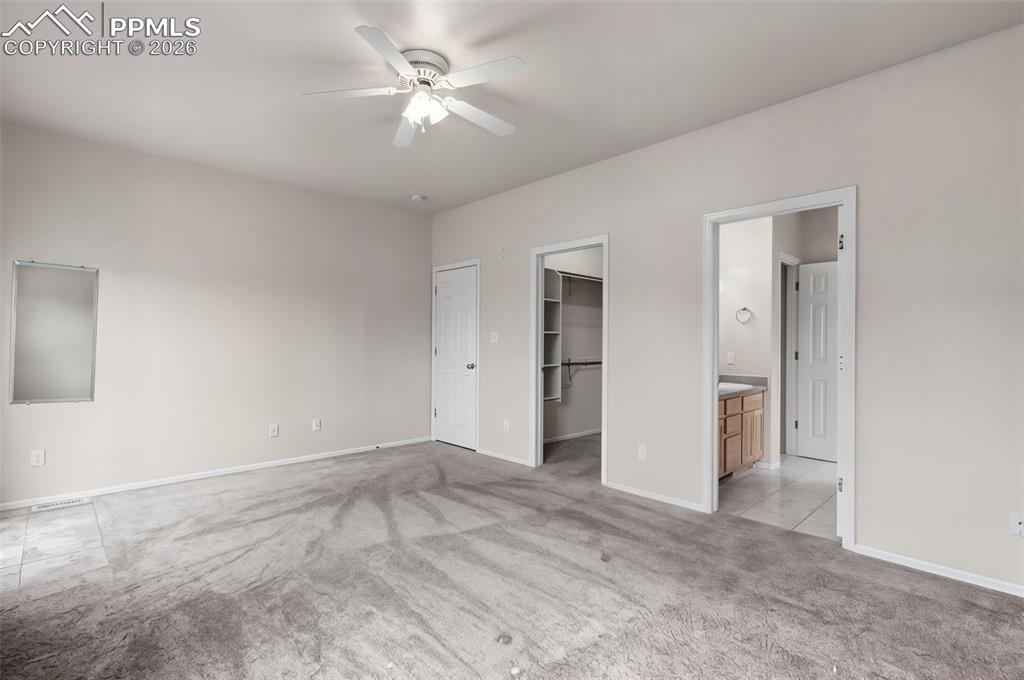 Image 18 of 28: Bathroom with vanity, tub / shower combination, light tile patterned floors