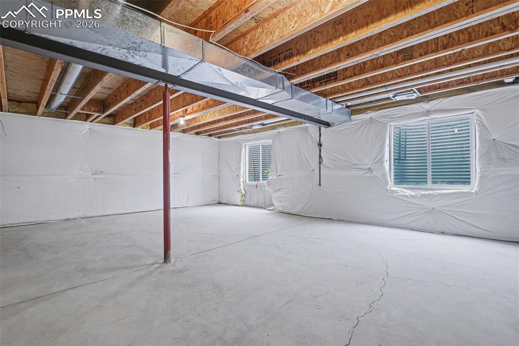 Image 23 of 28: Walk in closet featuring carpet floors