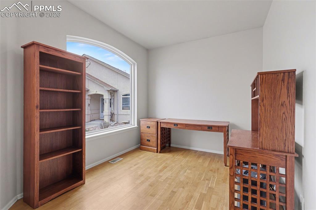 Image 5 of 28: Unfurnished room featuring french doors and light wood-style floors