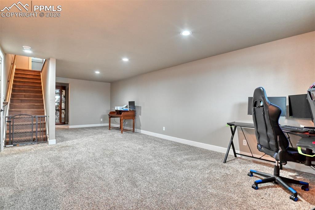 Image 30 of 50: Home office featuring light carpet and recessed lighting