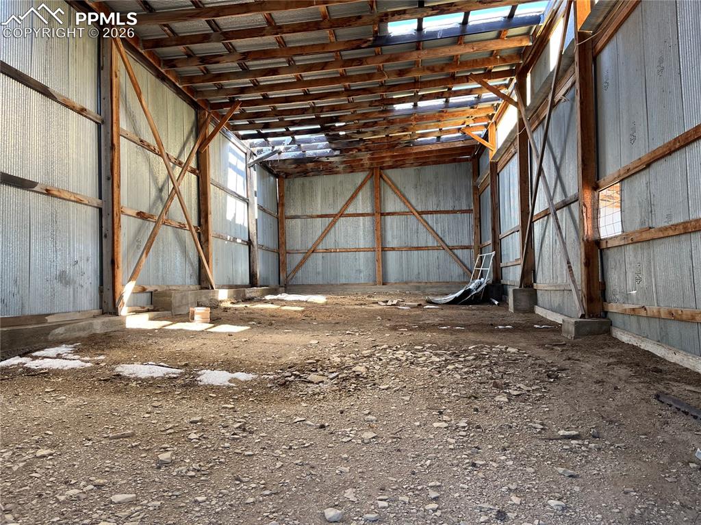 Image 50 of 50: Misc room featuring metal wall and a high ceiling
