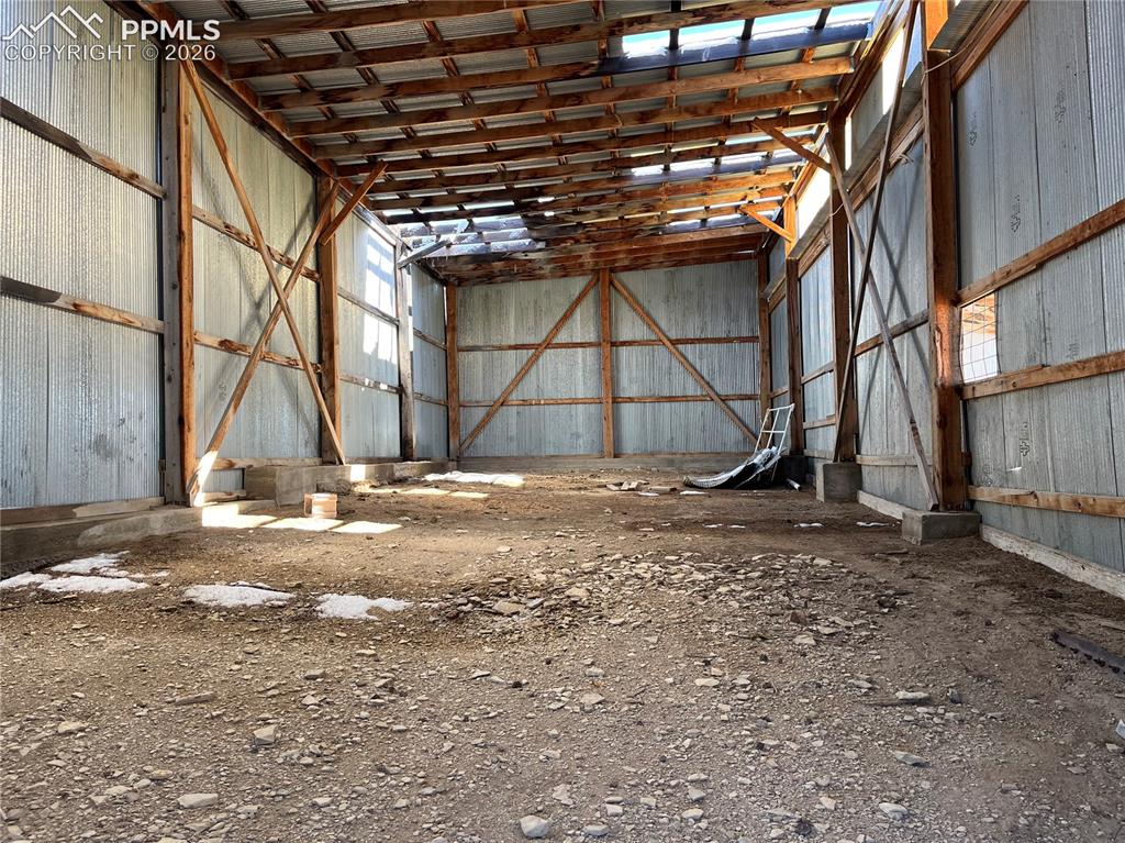 Image 50 of 50: Misc room featuring metal wall and a high ceiling