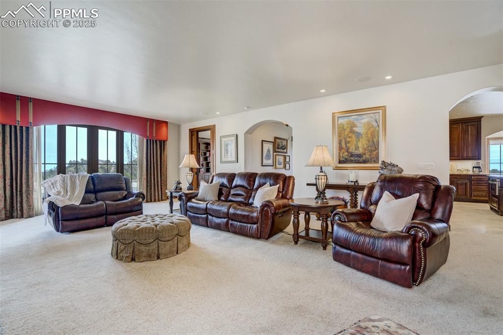 Image 13 of 50: Family room with walk-out to side patio