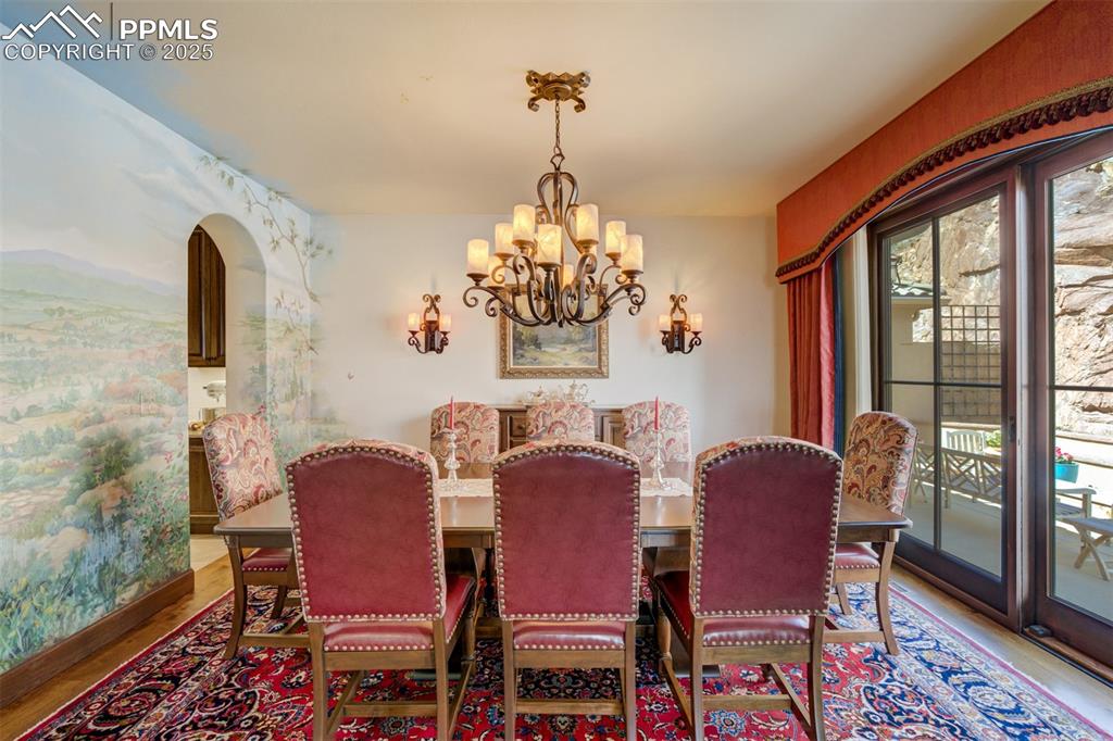 Image 14 of 50: Formal dining with walk-out to main patio