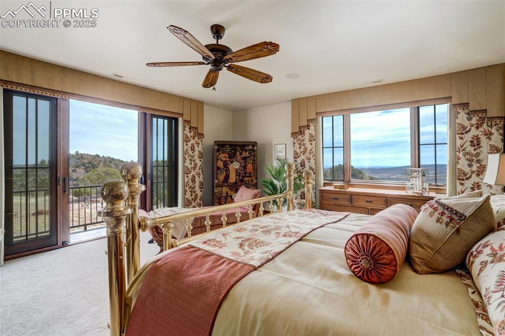 Image 33 of 50: Primary bedroom with sweeping views!