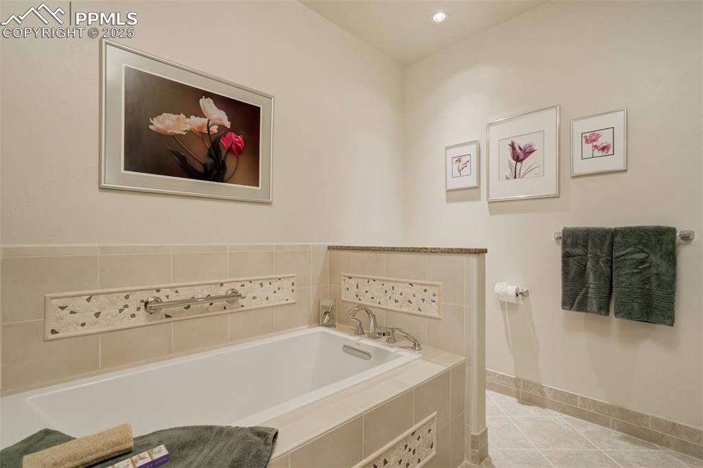 Image 41 of 50: Full bathroom with shower and tub