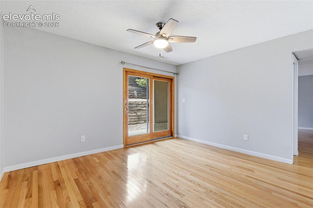 Image 12 of 50: Light wood-finish flooring with a neutral wall color