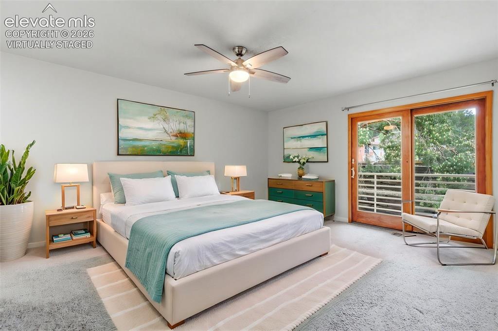 Image 24 of 50: Virtually Staged -
Light-filled primary featuring light gray carpeting and