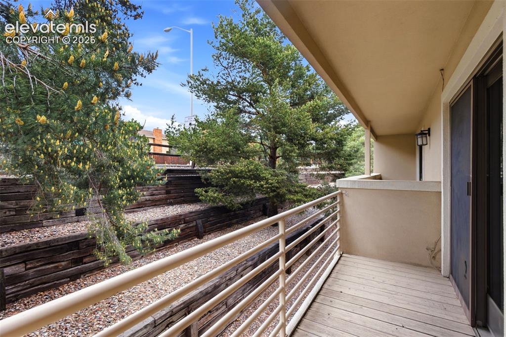 Image 41 of 50: Private balcony featuring wood-finish flooring and a metal railing